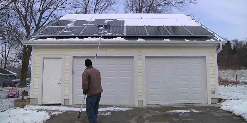 clearing snow from solar panels